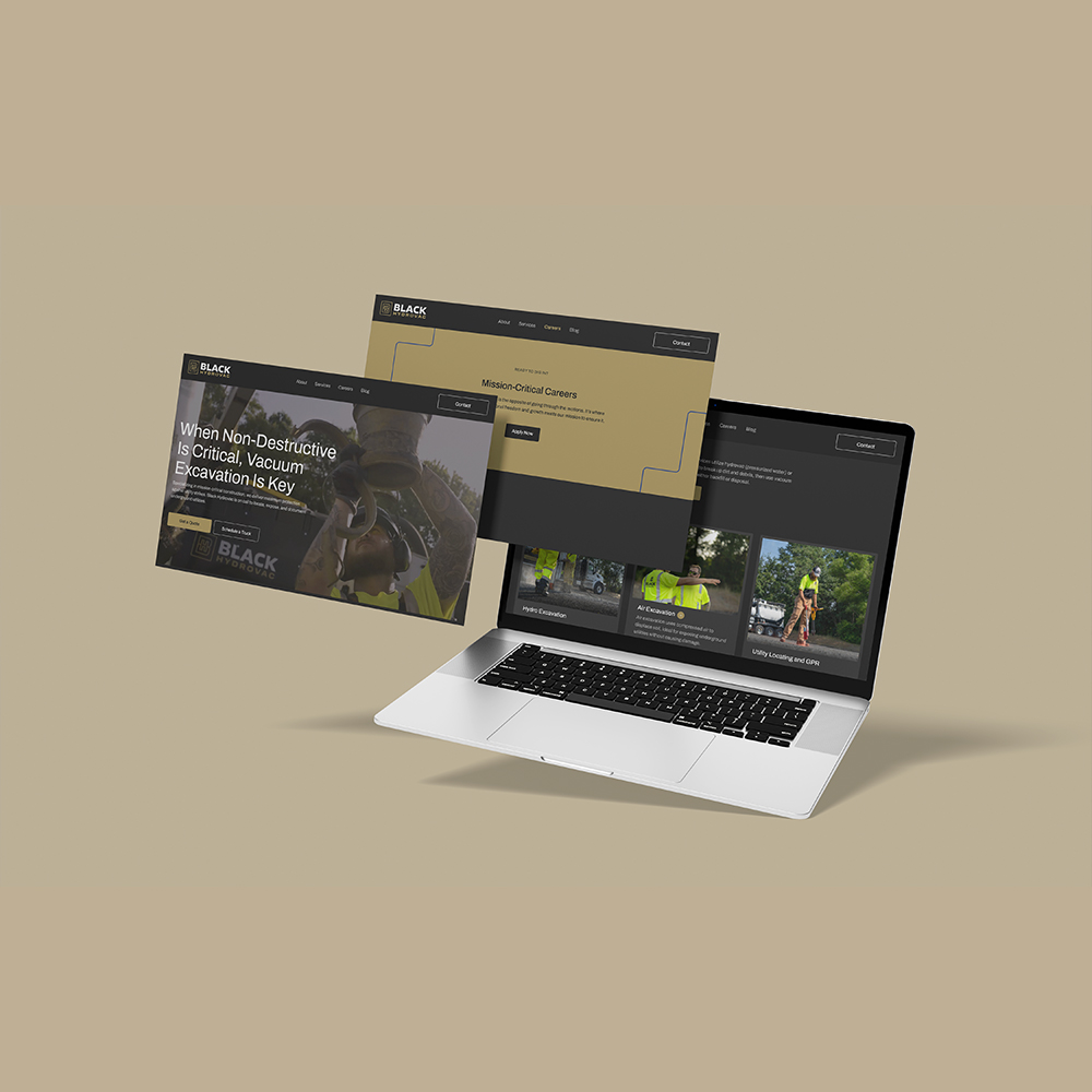 Laptop with construction website and two floating screens on beige.