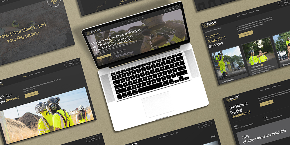 Laptop with excavation website and related mockups nearby.