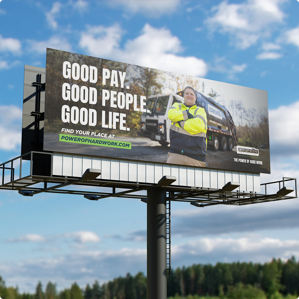 Billboard: Worker in safety jacket by truck, reads 