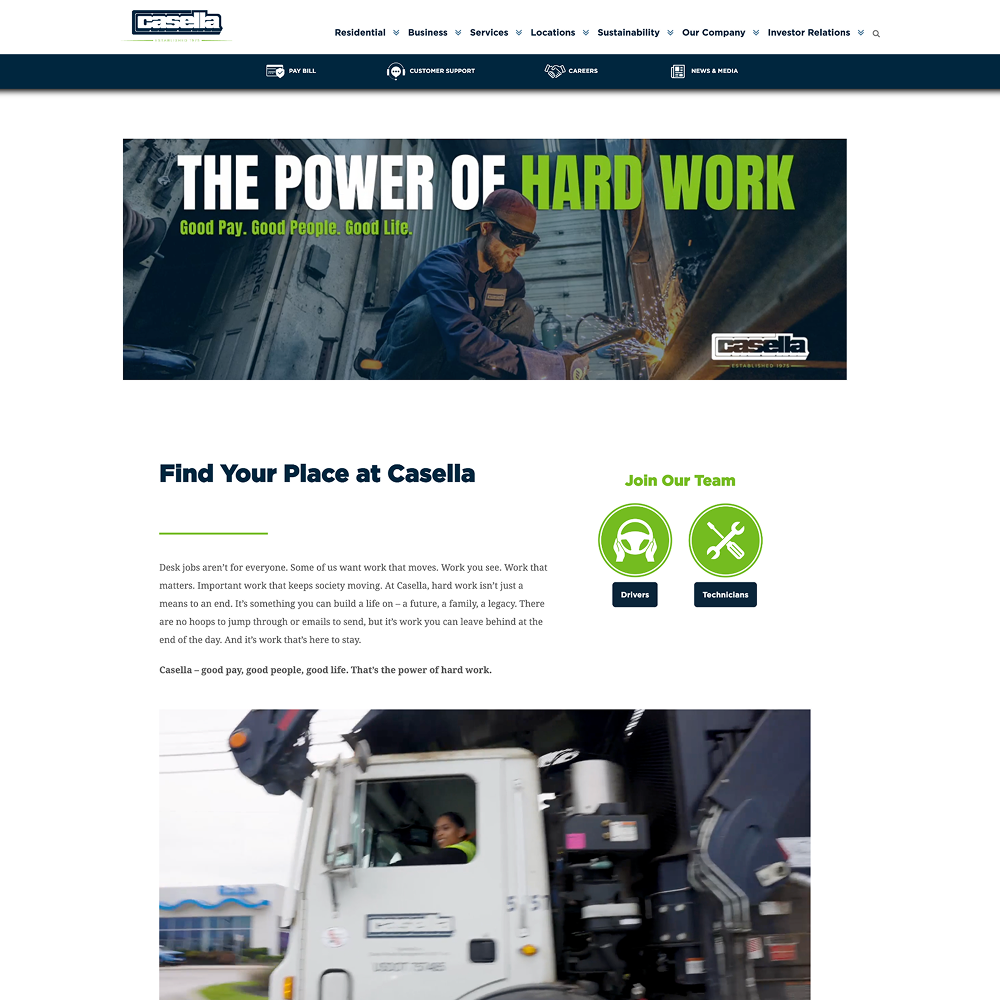 Worker at machine under “Power of Hard Work” banner.