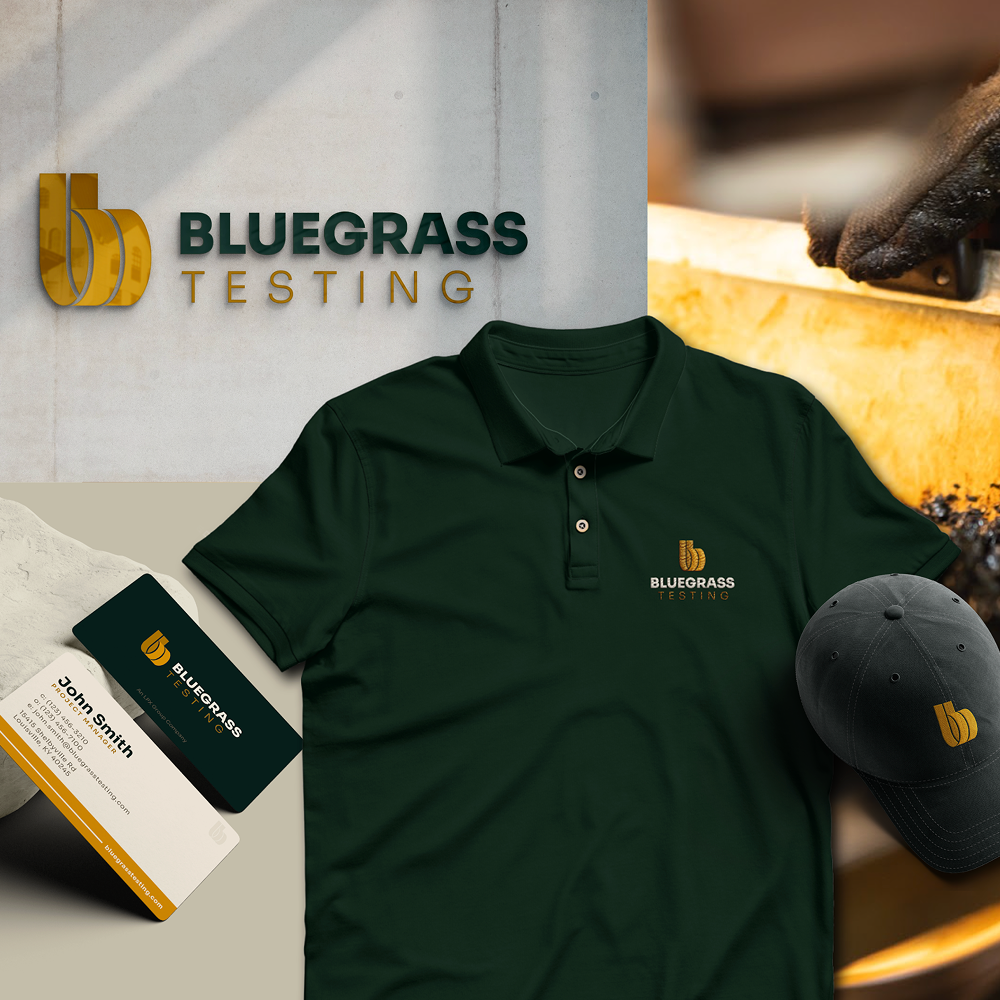 Bluegrass Testing merchandise: polo, cap, business cards with gold/green logo.