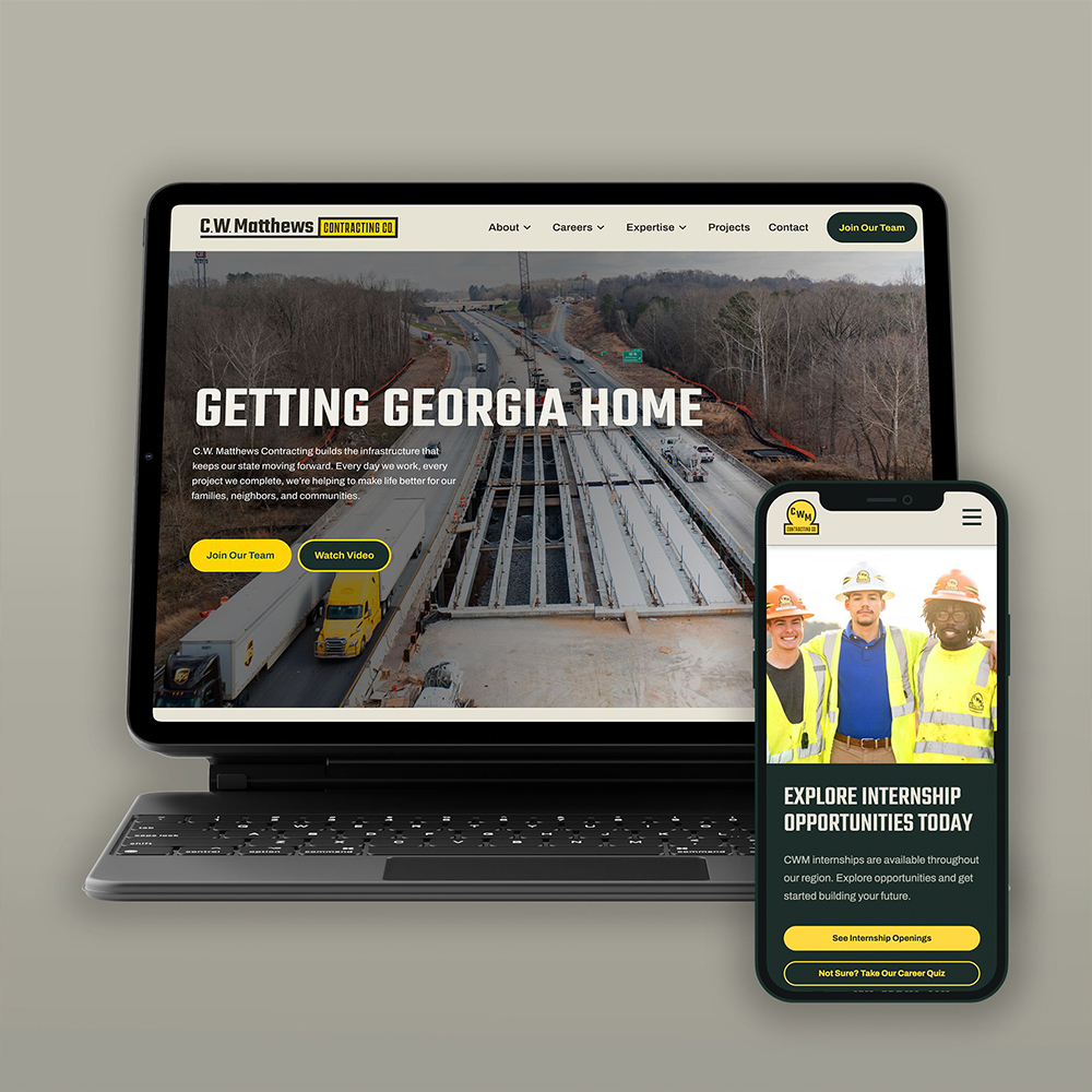 Laptop and phone show C.W. Matthews website with construction scene.