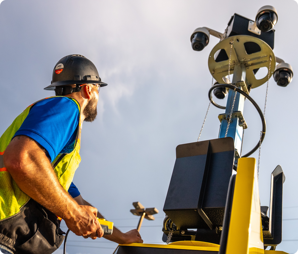 Employee working on commercial security camera equipment.
