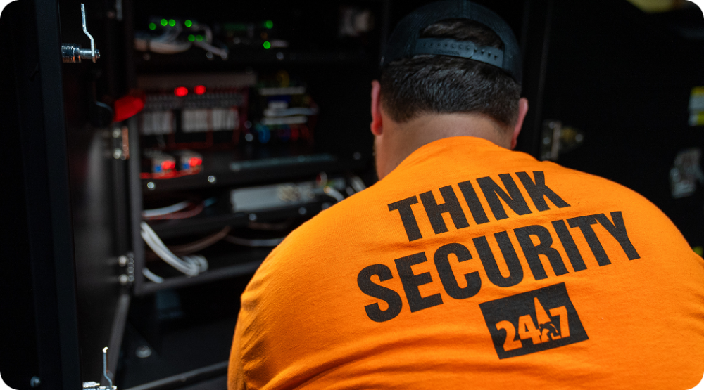 Man in a orange shirt that says 