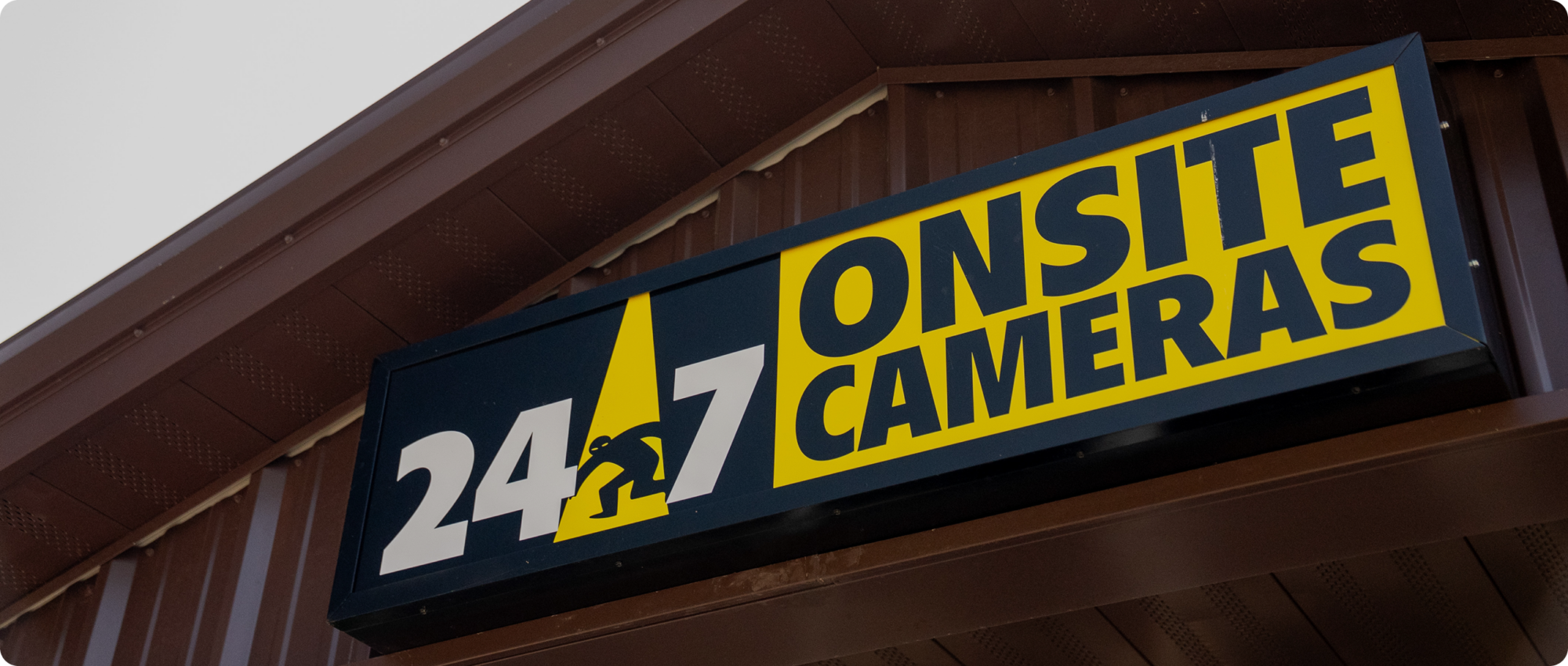 Logo on the front of the building for 24/7 Onsite Cameras.