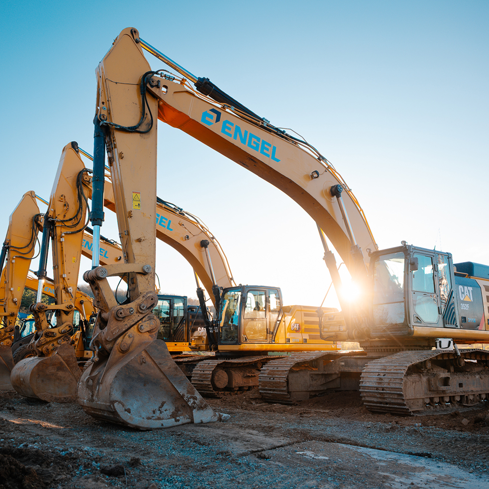 row of yellow excavators